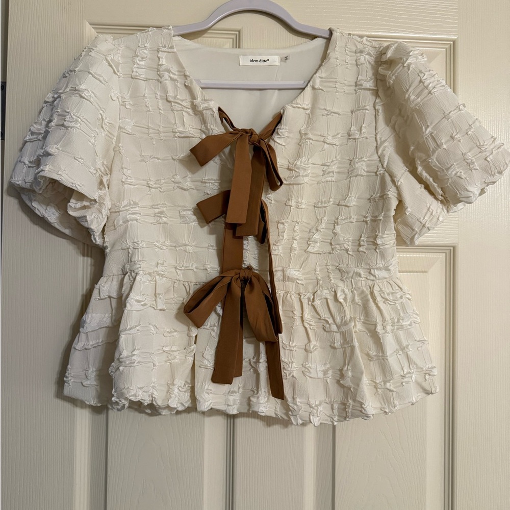 Textured Cream Peplum Blouse with Brown Ribbon Ties